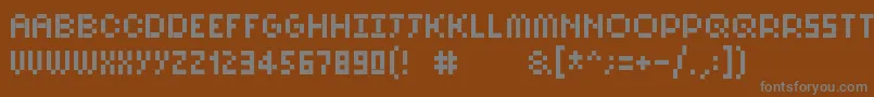 Pixelsix10-Schriftart – Graue Schriften auf braunem Hintergrund