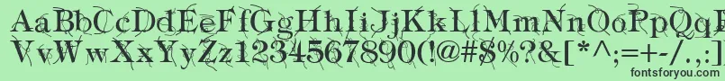 Fonte TypographyTiesRegular – fontes pretas em um fundo verde