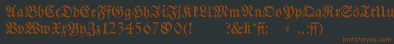 Fraktura-fontti – ruskeat fontit mustalla taustalla