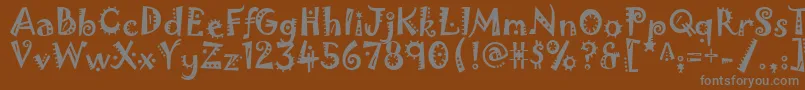 Jokerman Font – Gray Fonts on Brown Background