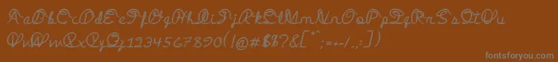 フォントMedleyScript – 茶色の背景に灰色の文字