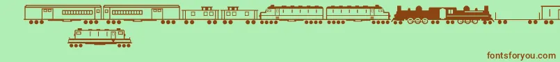 Fonte TrainsRegular – fontes marrons em um fundo verde