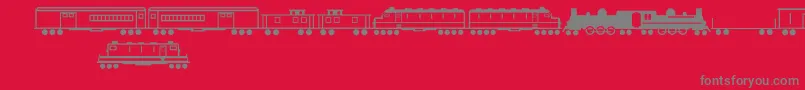 TrainsRegular-Schriftart – Graue Schriften auf rotem Hintergrund
