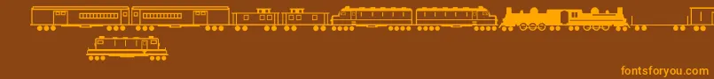 TrainsRegular Font – Orange Fonts on Brown Background