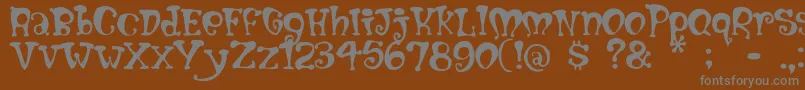 Mumblypegs-fontti – harmaat kirjasimet ruskealla taustalla