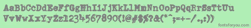 DumboldtypewriterHeavy-Schriftart – Graue Schriften auf grünem Hintergrund