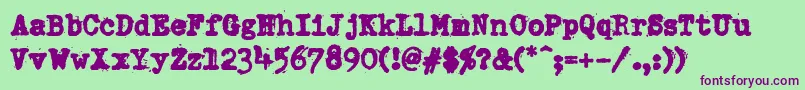 DumboldtypewriterHeavy-Schriftart – Violette Schriften auf grünem Hintergrund