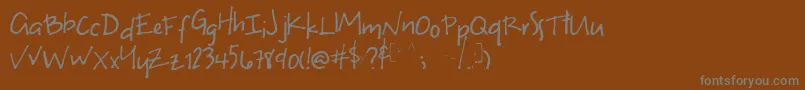 Unevenフォントについての詳細 フォントUneven – 茶色の背景に灰色の文字