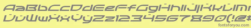 フォントOpticItalic – 黄色の背景に灰色の文字