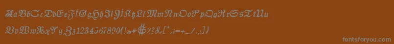 フォントAuldmagickBoldItalic – 茶色の背景に灰色の文字