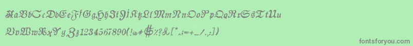 フォントAuldmagickBoldItalic – 緑の背景に灰色の文字