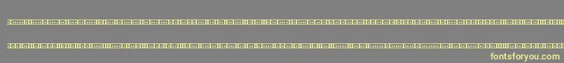 Czcionka BinaryX01sBrk – żółte czcionki na szarym tle