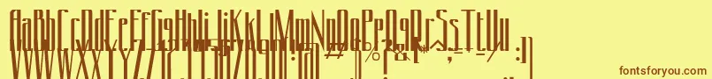 フォントConydecor – 茶色の文字が黄色の背景にあります。