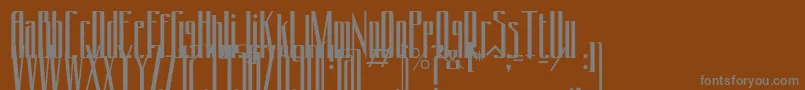 Conydecor-fontti – harmaat kirjasimet ruskealla taustalla
