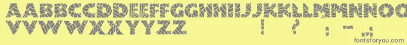 フォントJmhMummyFill – 黄色の背景に灰色の文字