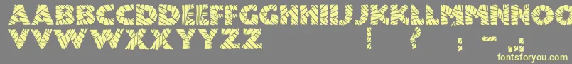Шрифт JmhMummyFill – жёлтые шрифты на сером фоне