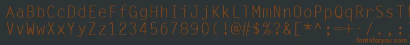 Шрифт Ukrmonospaced – коричневые шрифты на чёрном фоне