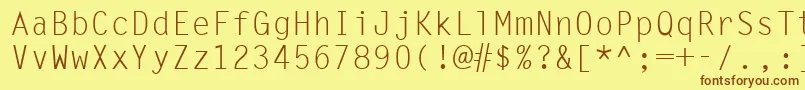 フォントUkrmonospaced – 茶色の文字が黄色の背景にあります。