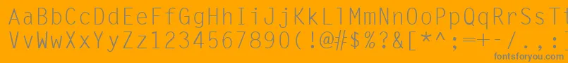 Ukrmonospaced-Schriftart – Graue Schriften auf orangefarbenem Hintergrund