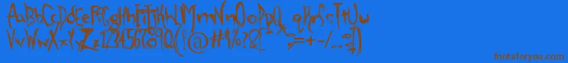 AlienStrawberry-Schriftart – Braune Schriften auf blauem Hintergrund