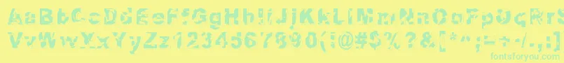 Dystopia Font – Green Fonts on Yellow Background
