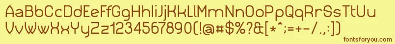 フォントSimm023 – 茶色の文字が黄色の背景にあります。