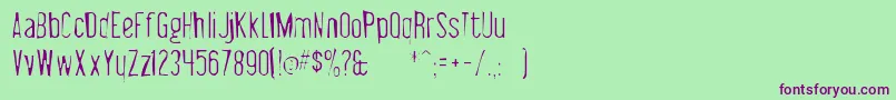 Libelsuitgaunt-Schriftart – Violette Schriften auf grünem Hintergrund