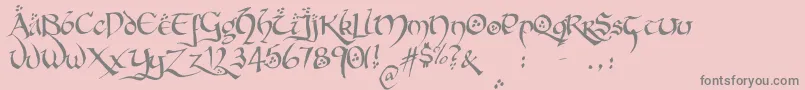 HobbitonBrushhandhobbitonBrush-Schriftart – Graue Schriften auf rosa Hintergrund