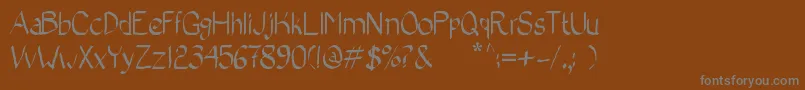 BadCalligraphic2 Font – Gray Fonts on Brown Background