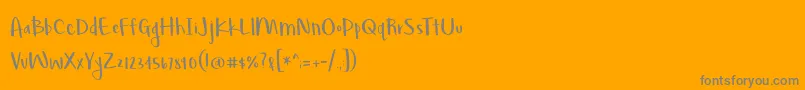 BmdLovegood-Schriftart – Graue Schriften auf orangefarbenem Hintergrund