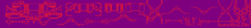 DeborahExtrasOrnaments Font – Red Fonts on Purple Background