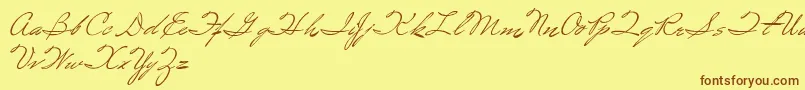 フォントSpirulina – 茶色の文字が黄色の背景にあります。