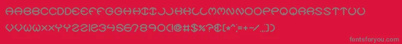 フォントSpheroidsXBrk – 赤い背景に灰色の文字