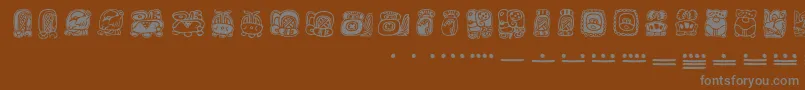 Mayamonthglyphs-Schriftart – Graue Schriften auf braunem Hintergrund