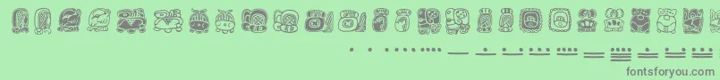 Mayamonthglyphs-Schriftart – Graue Schriften auf grünem Hintergrund