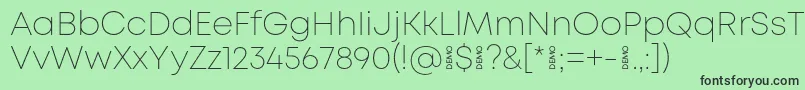 Шрифт MontExtralightdemo – чёрные шрифты на зелёном фоне