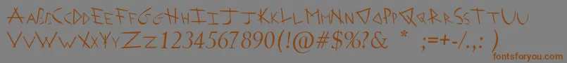 Czcionka ArrowheadIShahaItalic – brązowe czcionki na szarym tle