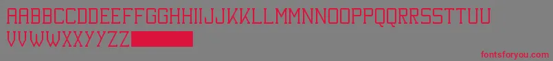 フォントKineticExtremeSolid – 赤い文字の灰色の背景