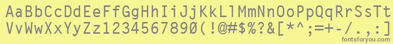 LetterGothicMtBold-fontti – harmaat kirjasimet keltaisella taustalla