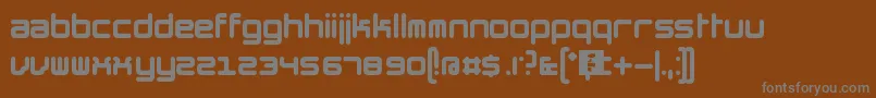 TheHummelFont-fontti – harmaat kirjasimet ruskealla taustalla