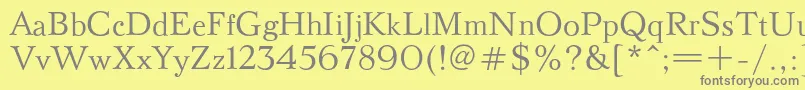 フォントBazhanovc – 黄色の背景に灰色の文字