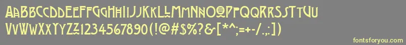 フォントModernistThree – 黄色のフォント、灰色の背景