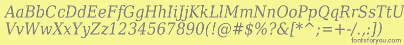 フォントDejavuSerifItalicCondensed – 黄色の背景に灰色の文字