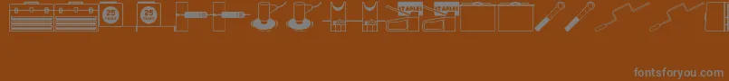 ToolsRuleJl-Schriftart – Graue Schriften auf braunem Hintergrund