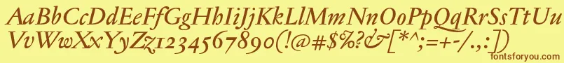 フォントJannontextmedosfItalic – 茶色の文字が黄色の背景にあります。