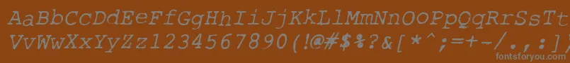 Fonte RoughTypewriterItl – fontes cinzas em um fundo marrom