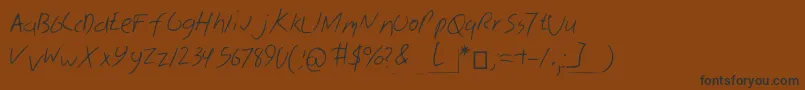 フォントSkribal – 黒い文字が茶色の背景にあります