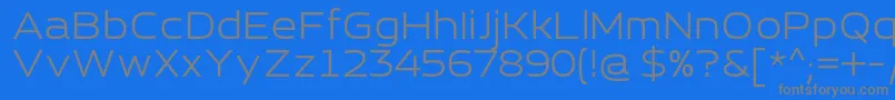 フォントEsqaderoFfCy4fRegular – 青い背景に灰色の文字