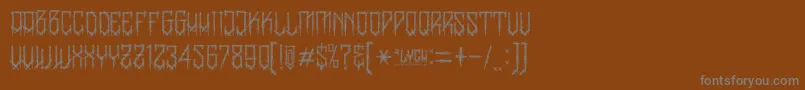 BanglychRhIi-fontti – harmaat kirjasimet ruskealla taustalla