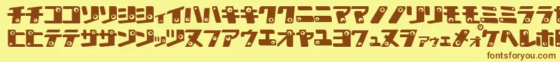 フォントKanK – 茶色の文字が黄色の背景にあります。